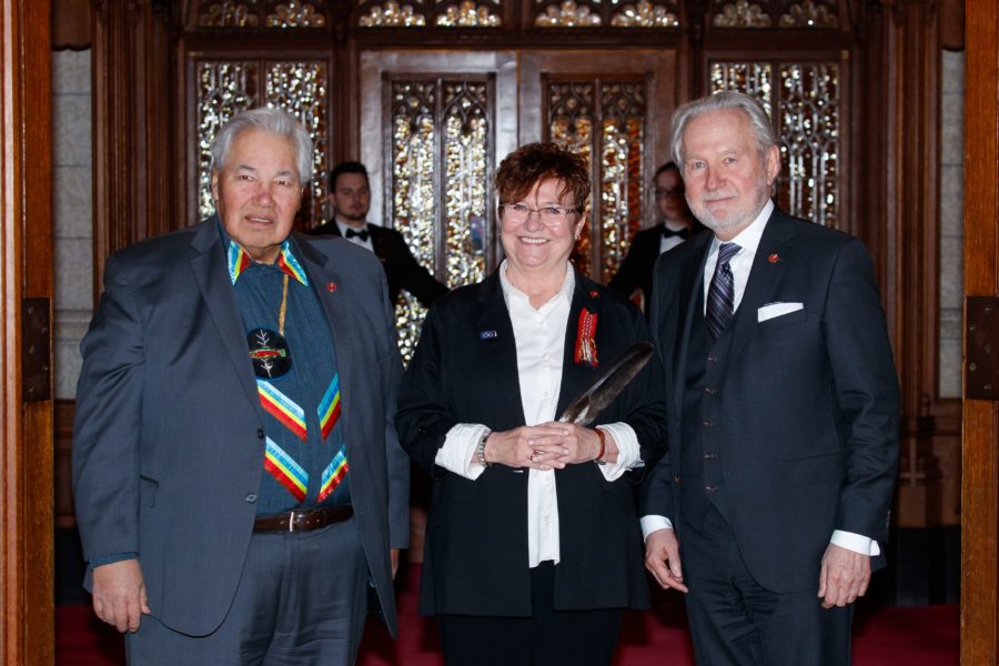 Senator Murray Sinclair (left) and Senator Peter Harder (right) welcome Senator Yvonne Boyer to the Red Chamber for the first time on March 20, 2018. (Photo: Greg Kolz)